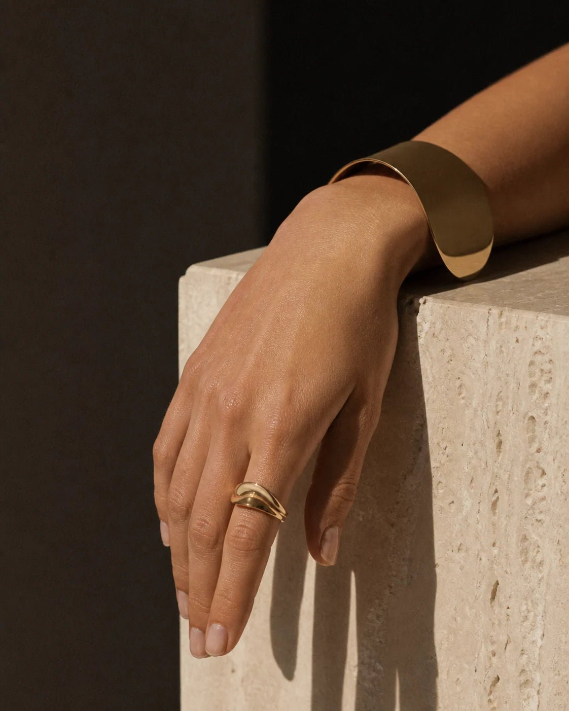 Gold ring and cuff editorial concept